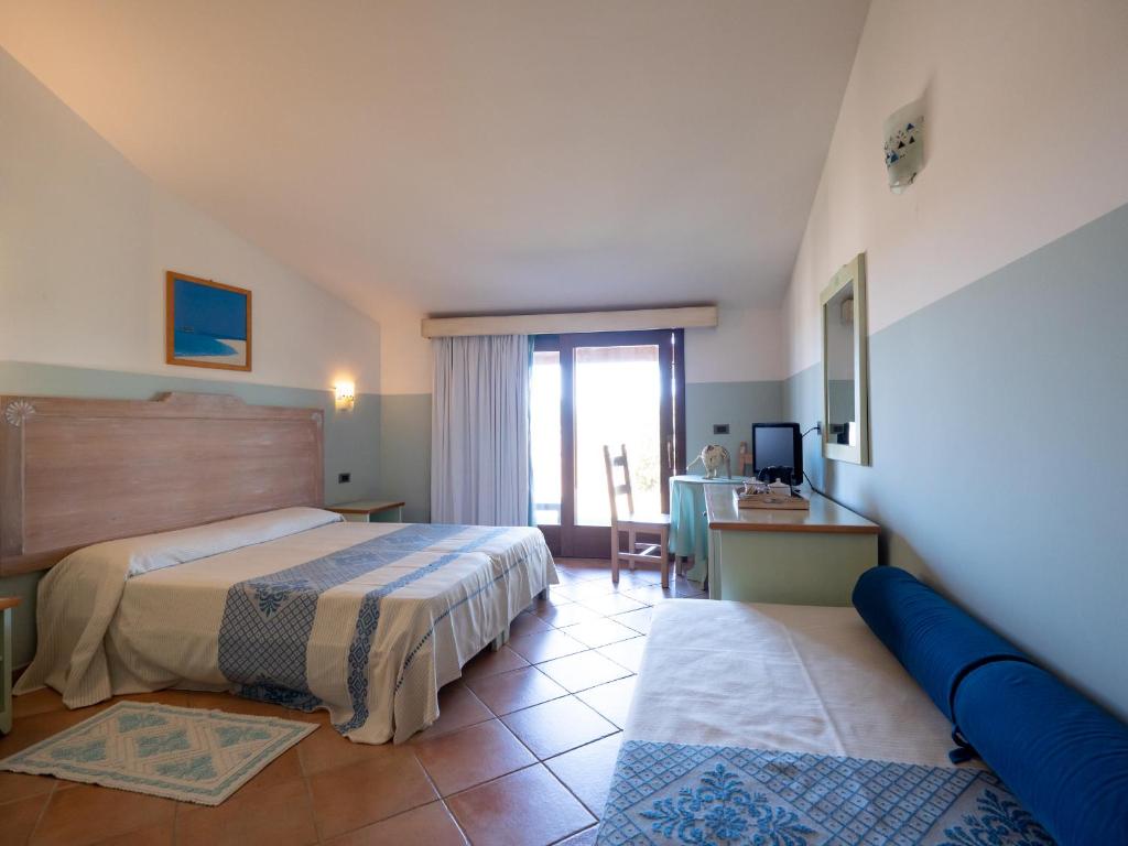 Postel nebo postele na pokoji v ubytování Hotel Luci Del Faro