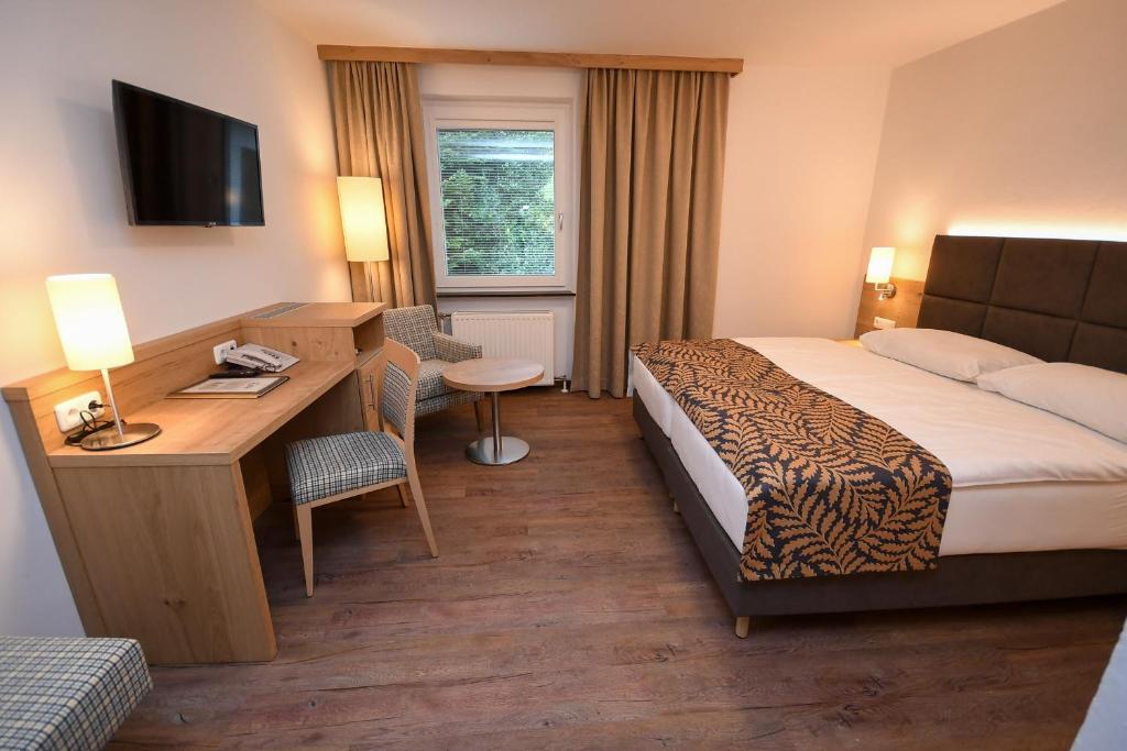Letto o letti in una camera di Seegasthof Hois'n Wirt - Hotel mit Wellnessbereich
