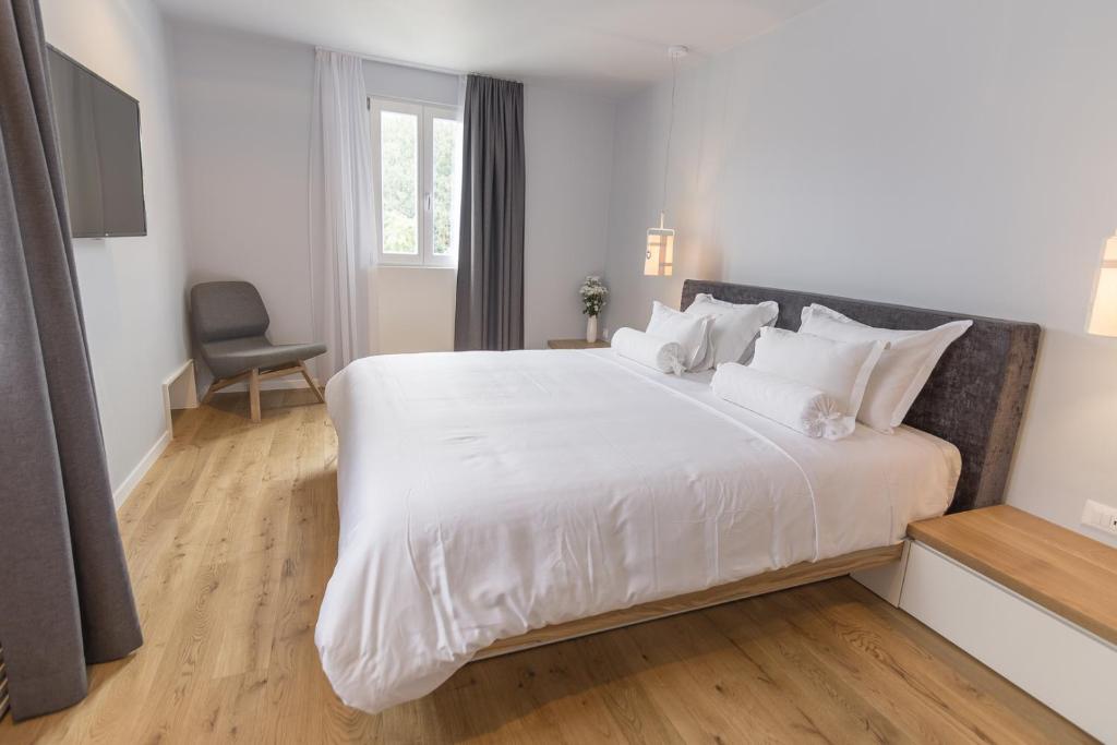 Postel nebo postele na pokoji v ubytování Divota Apartment Hotel