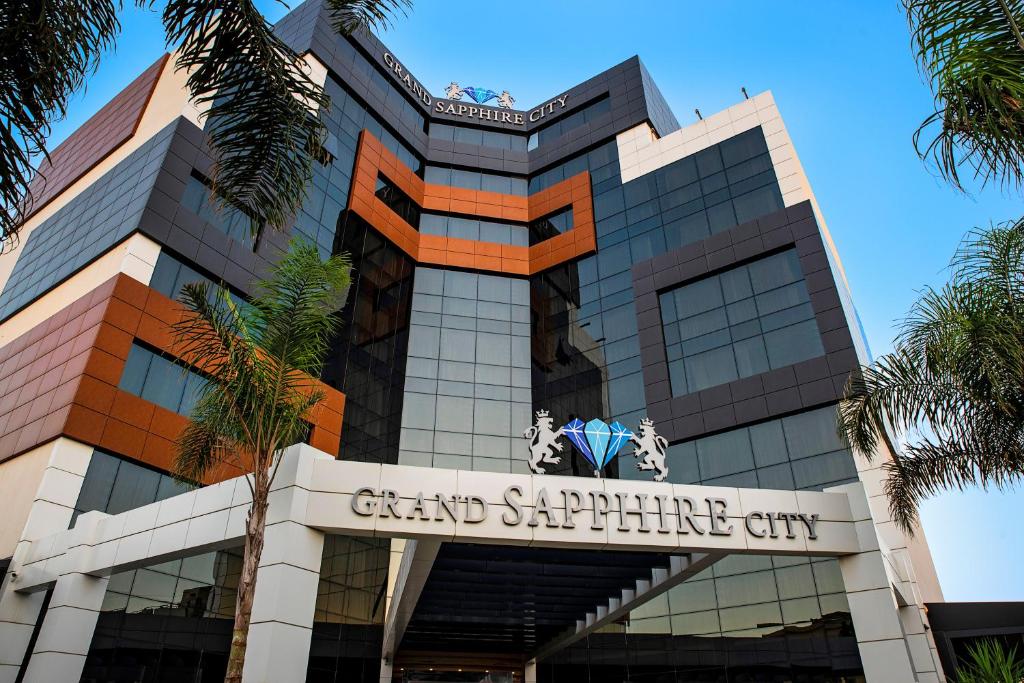 a building with a sign that reads grand sapphire city at Grand Sapphire City Hotel in Famagusta