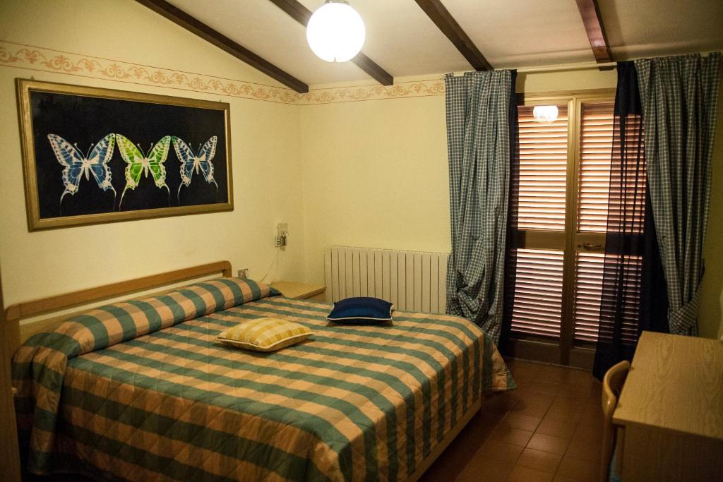 Postel nebo postele na pokoji v ubytování Albergo Ristorante Belvedere