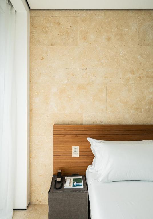 Postel nebo postele na pokoji v ubytování C-Hotel & Spa