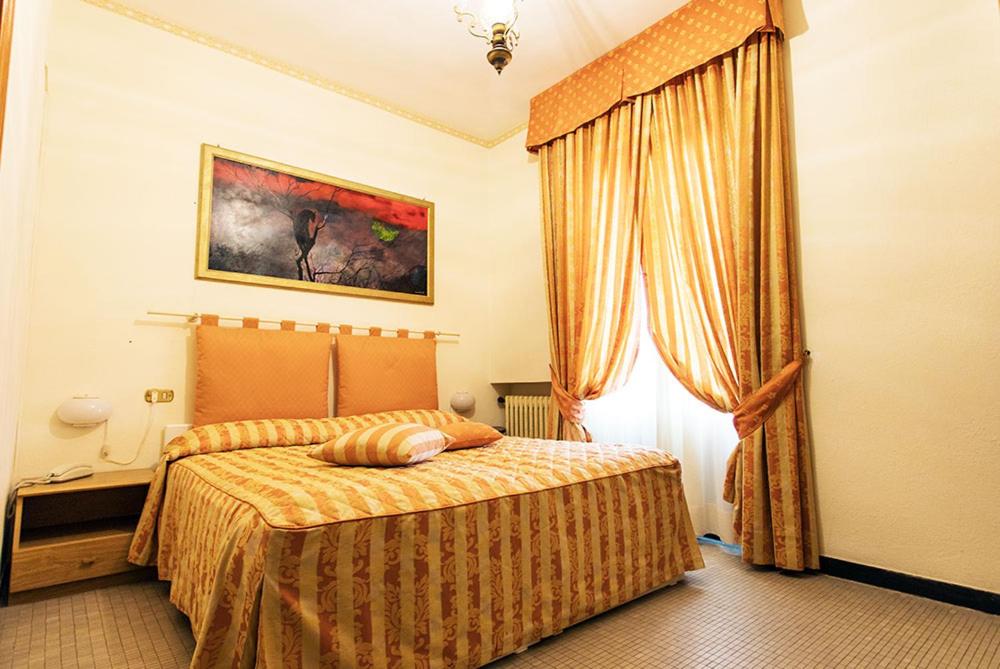 Postel nebo postele na pokoji v ubytování Albergo Ristorante Belvedere