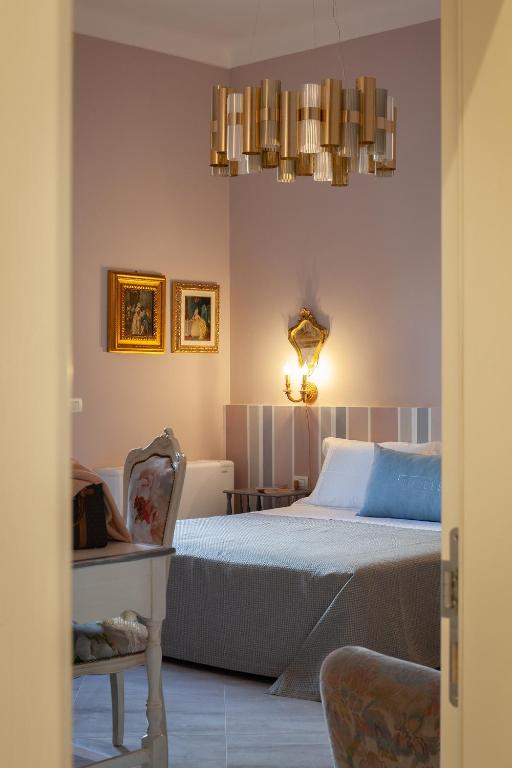 Posteľ alebo postele v izbe v ubytovaní Coclee Suite Palace