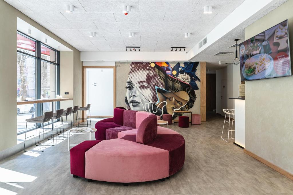 The lobby or reception area at Optima Collection Mural Lviv