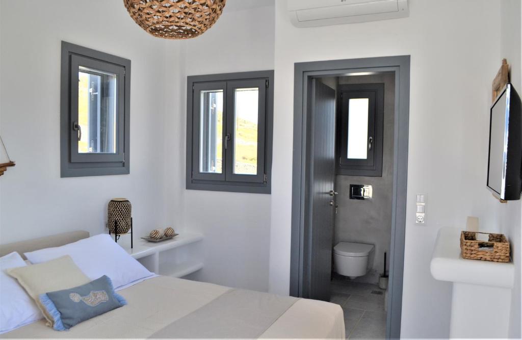 Postel nebo postele na pokoji v ubytování Krotiri View Paros