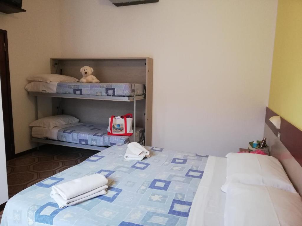Postel nebo postele na pokoji v ubytování Hotel Cesari