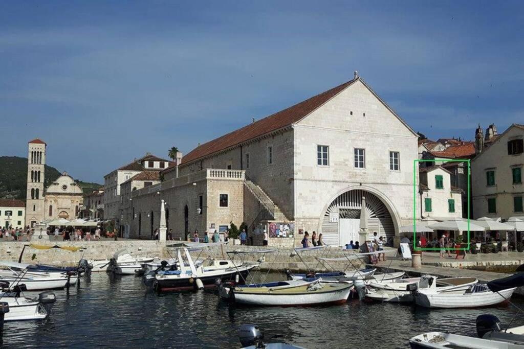a group of boats docked in a harbor next to a building at The Heart of Hvar in Hvar