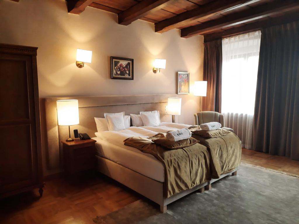 Posteľ alebo postele v izbe v ubytovaní Hotel Rubinstein