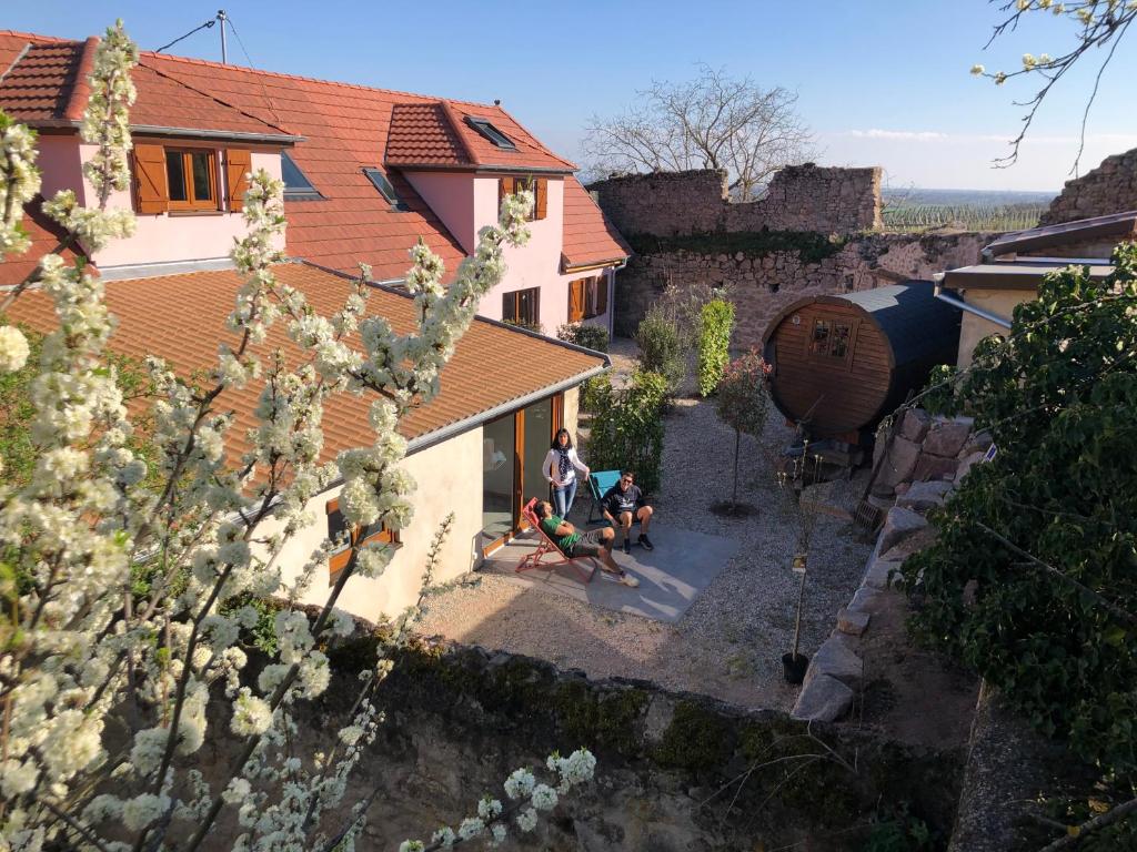 an overhead view of a house with people sitting in a yard at Le Refuge du Rempart in Dambach-la-Ville