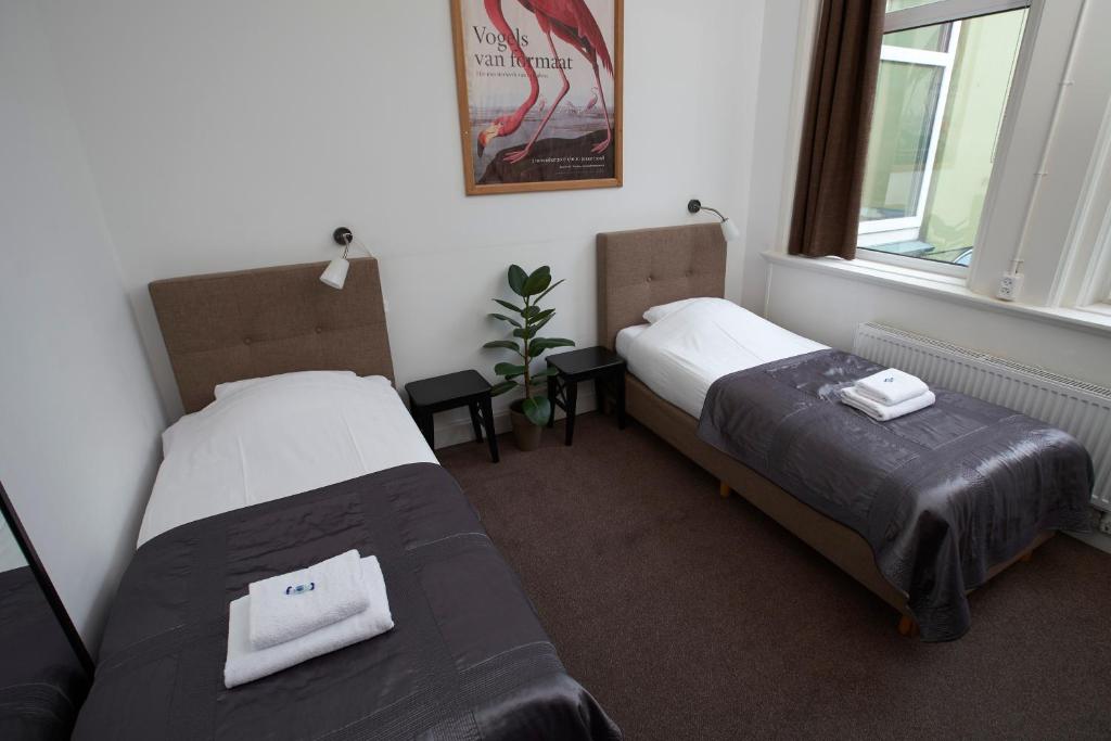 Postel nebo postele na pokoji v ubytování Bed & Breakfast Hotel Malts