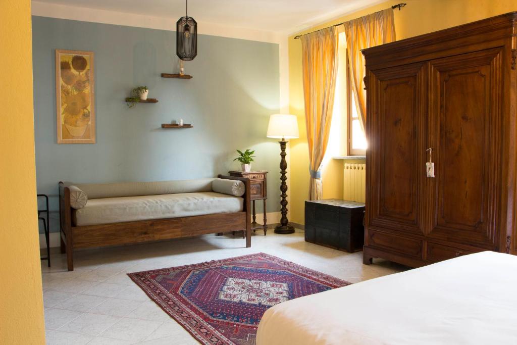Postel nebo postele na pokoji v ubytování L'Aromatario