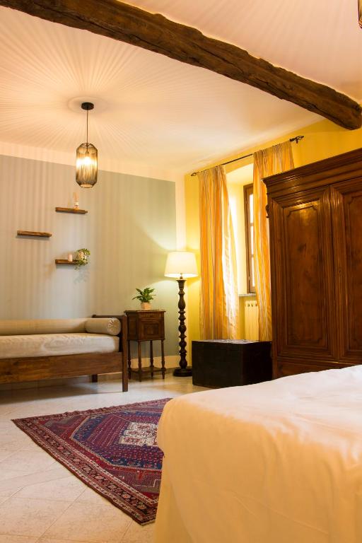 Postel nebo postele na pokoji v ubytování L'Aromatario