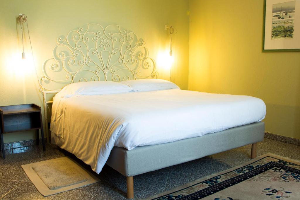 Postel nebo postele na pokoji v ubytování L'Aromatario