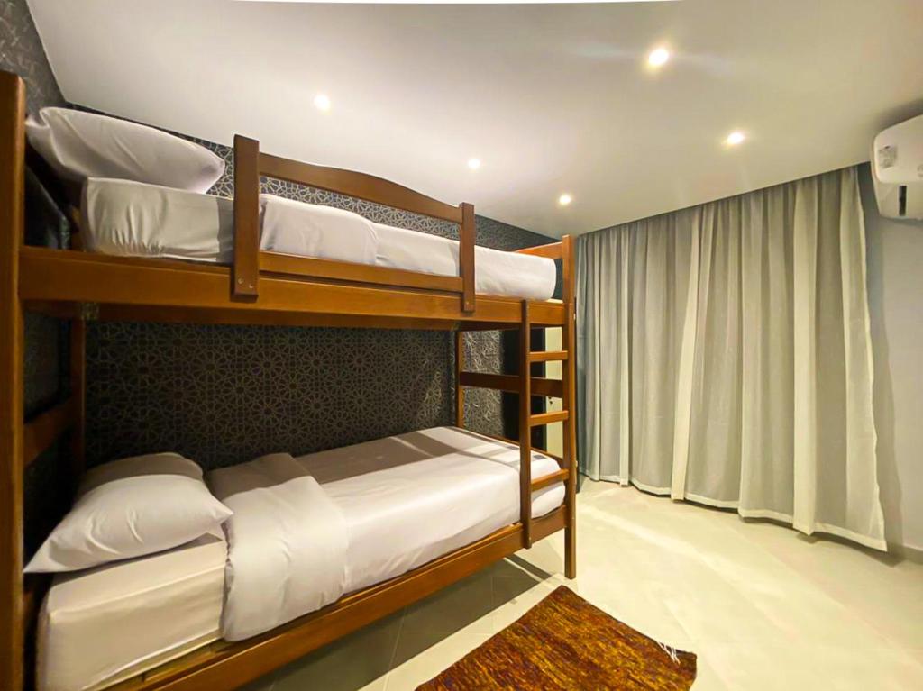 A bed or beds in a room at Arabian Nights in the heart of historic Alexandria