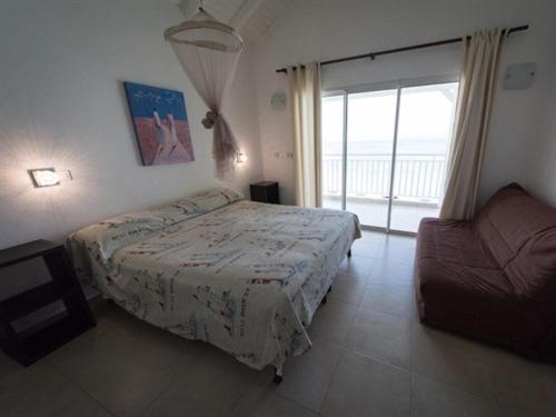 Postel nebo postele na pokoji v ubytování Coco Beach Marie-Galante