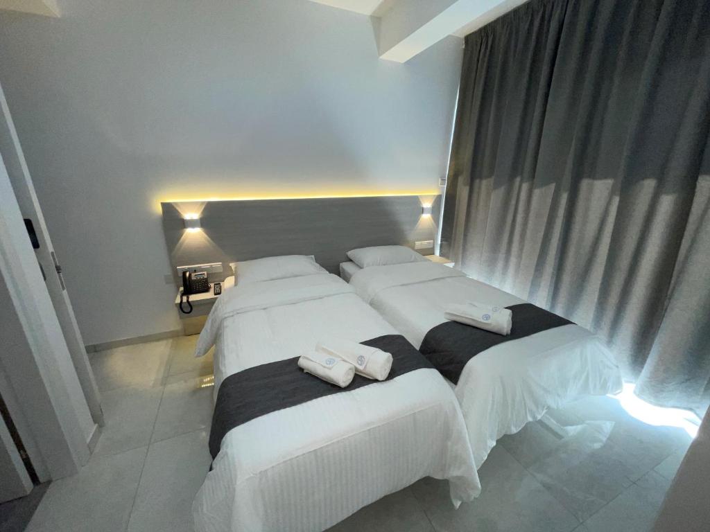 Cama ou camas em um quarto em La Veranda Hotel