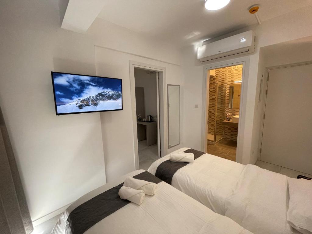 Cama ou camas em um quarto em La Veranda Hotel