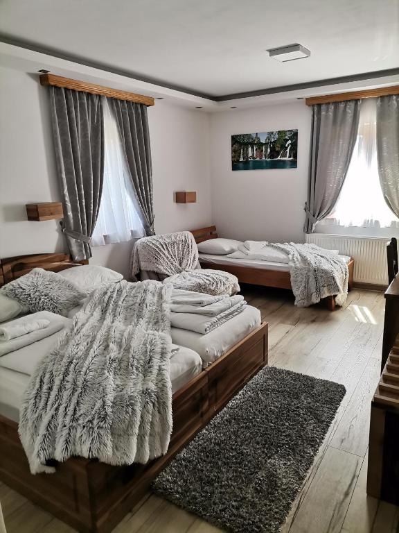 Postel nebo postele na pokoji v ubytování Pansion House Prijeboj