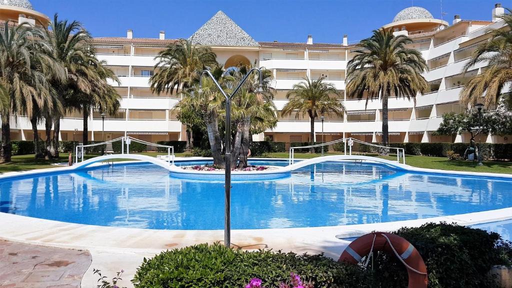 a large swimming pool in front of a large building at Terrazas Altamar in Alcossebre