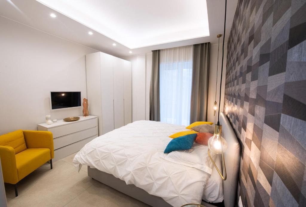 Postel nebo postele na pokoji v ubytování Napoli City Center - Appartamenti e Camere