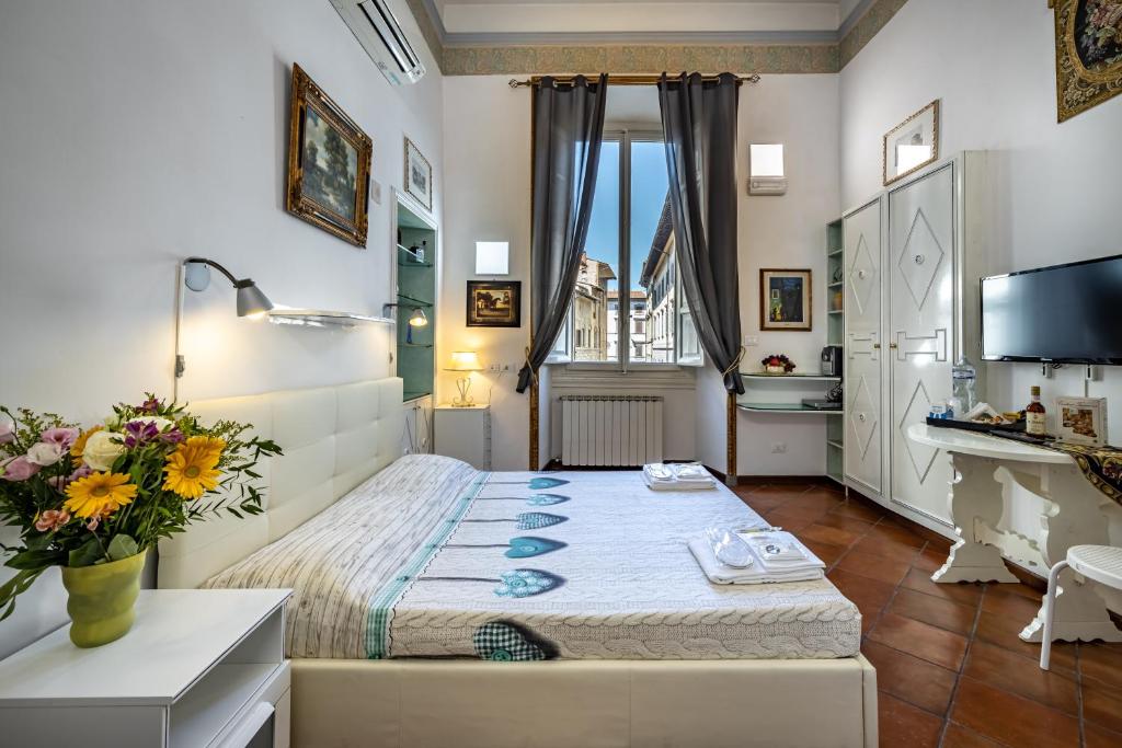 Postel nebo postele na pokoji v ubytování Duomo Palace