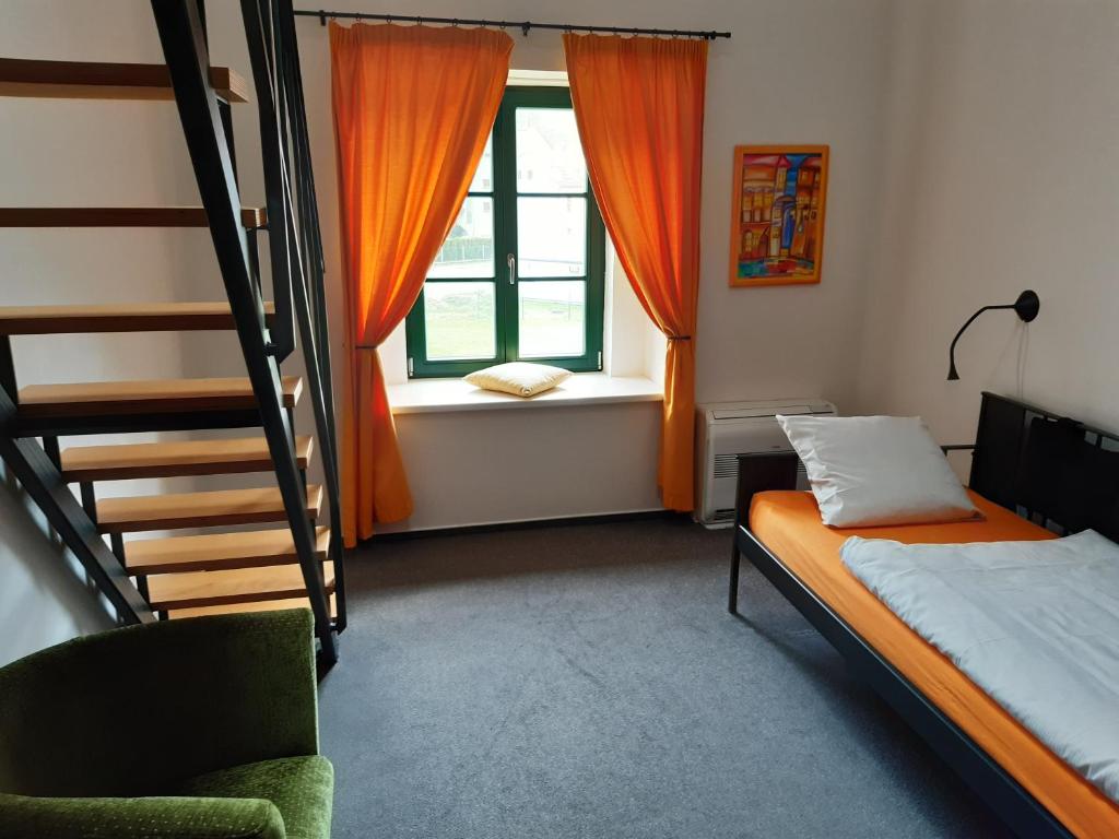 Postel nebo postele na pokoji v ubytování Wellness hotel Lihovar