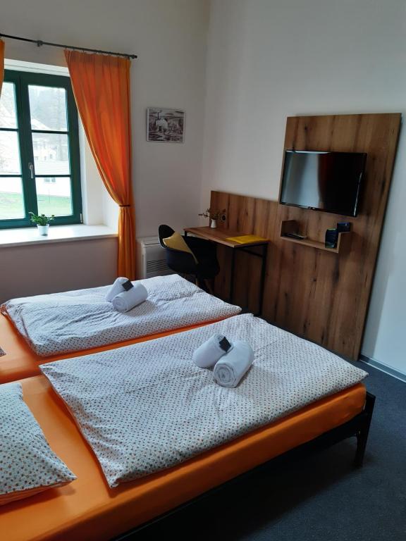 Postel nebo postele na pokoji v ubytování Wellness hotel Lihovar