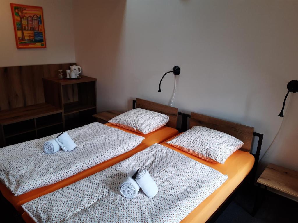 Postel nebo postele na pokoji v ubytování Wellness hotel Lihovar