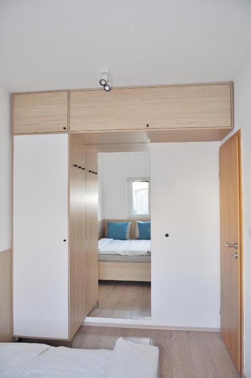Łóżko lub łóżka w pokoju w obiekcie MAXIM Apartments