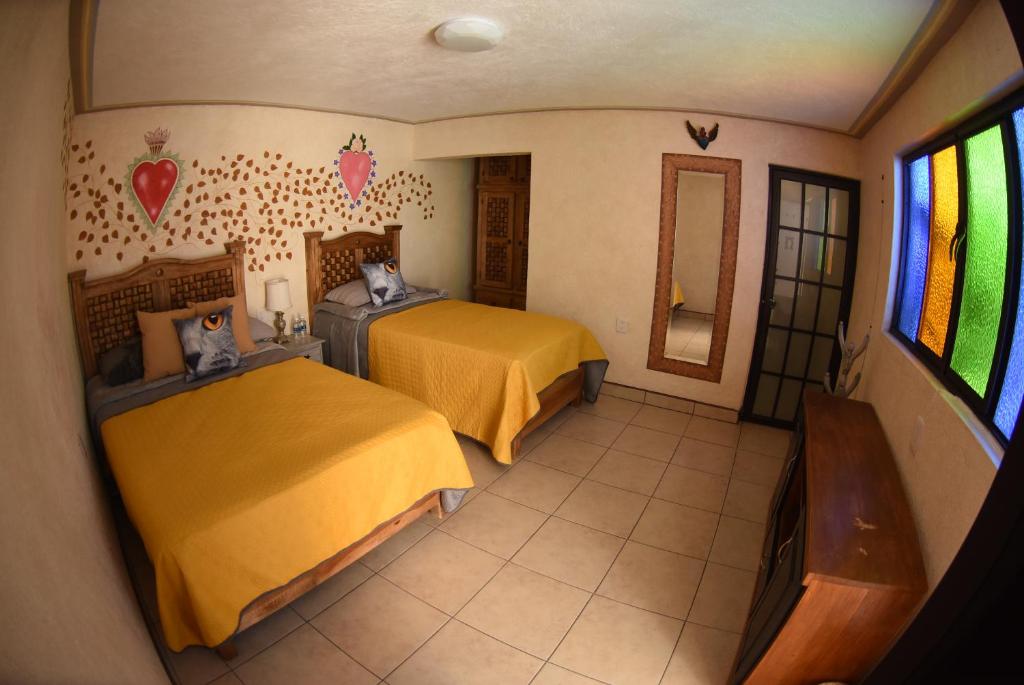 Postel nebo postele na pokoji v ubytování HOTEL CASA LIMON