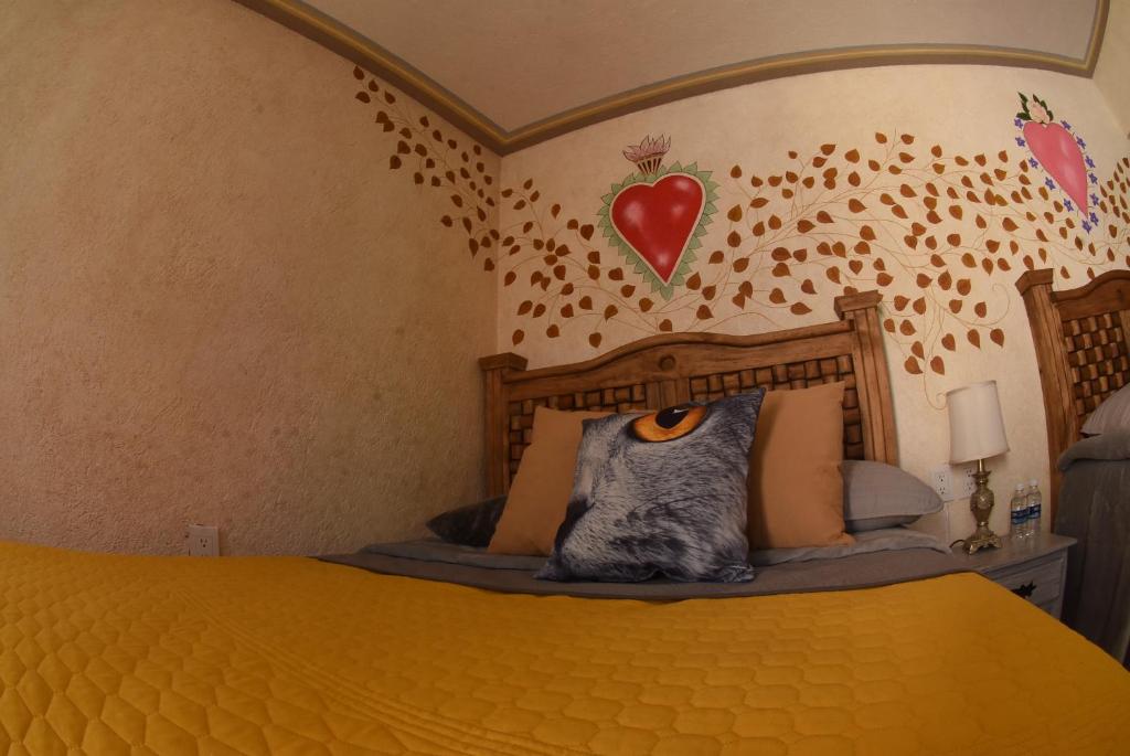 Postel nebo postele na pokoji v ubytování HOTEL CASA LIMON