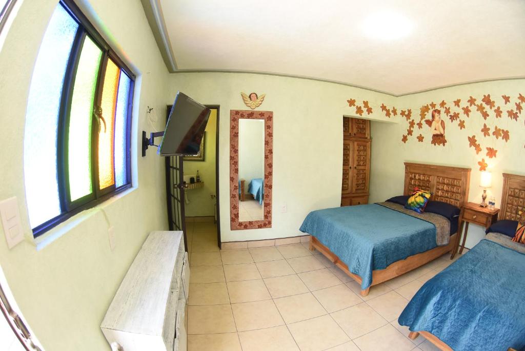 Postel nebo postele na pokoji v ubytování HOTEL CASA LIMON