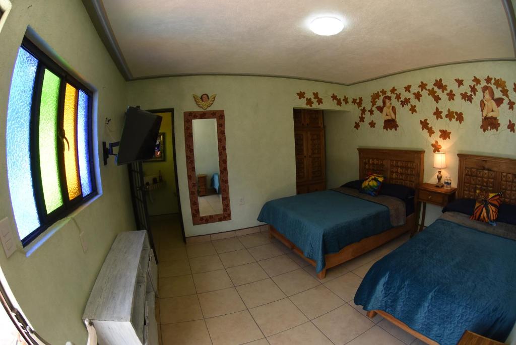Postel nebo postele na pokoji v ubytování HOTEL CASA LIMON