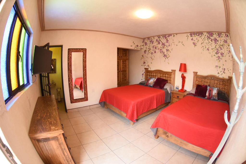 Postel nebo postele na pokoji v ubytování HOTEL CASA LIMON