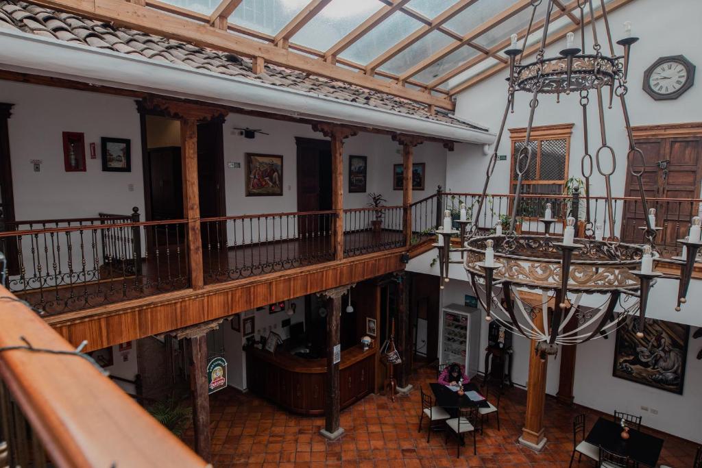 an overhead view of a building with a chandelier at Suites & Hotel El Quijote in Cuenca