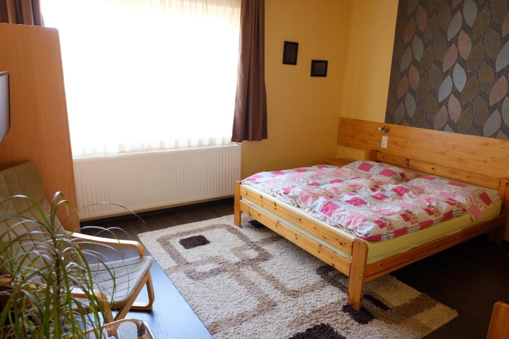 Posteľ alebo postele v izbe v ubytovaní Adél Apartman