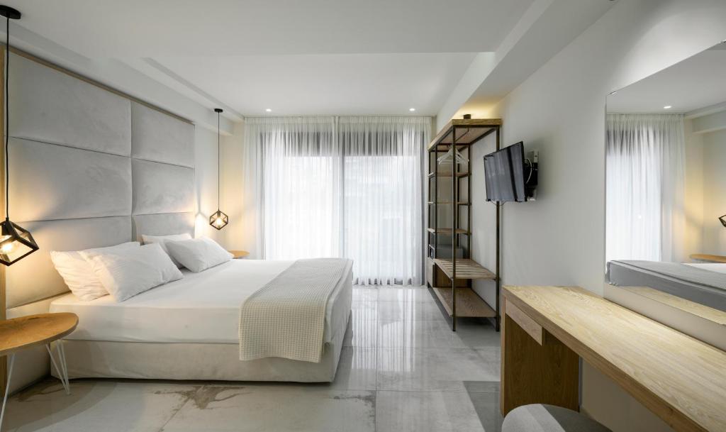 Кровать или кровати в номере Thetis Boutique Apartments