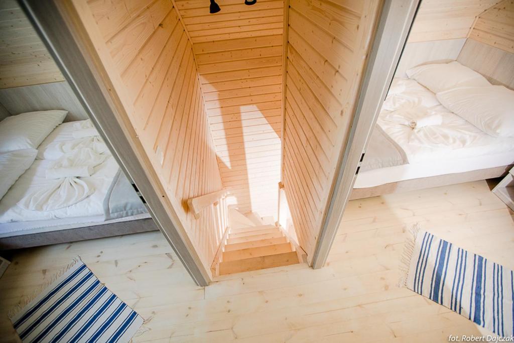 Postel nebo postele na pokoji v ubytování OŚRODEK KOLONIJNO WCZASOWY MEWA - przy plaży z basenem z podgrzewaną wodą i mini SPA