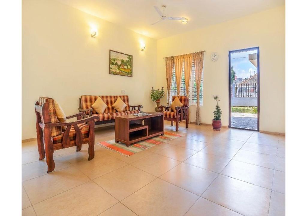 Posezení v ubytování Stays 42 - Oleander Suites Coorg