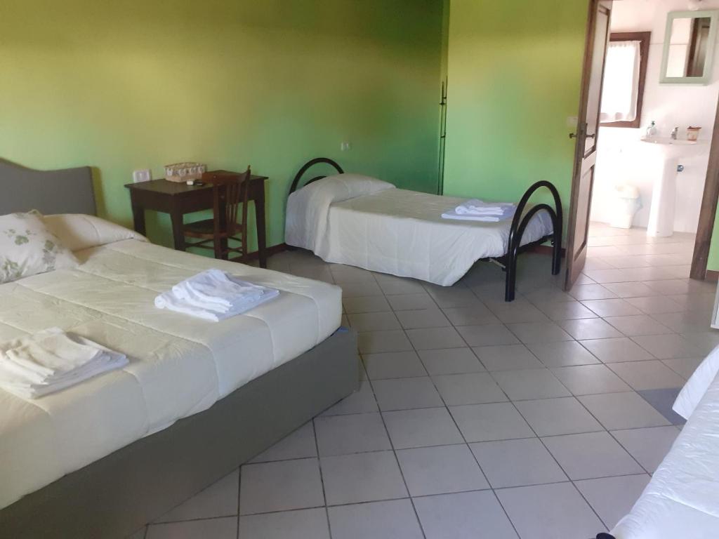 Postel nebo postele na pokoji v ubytování Agriturismo la Gioia