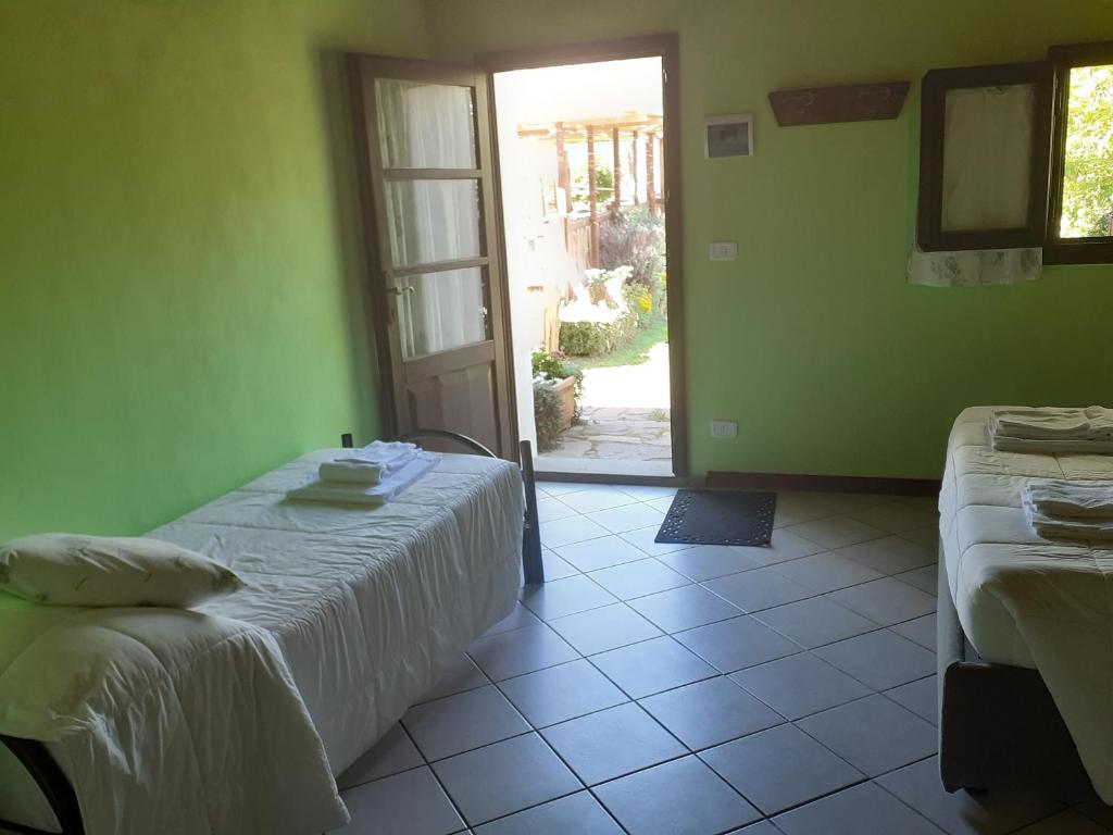 Postel nebo postele na pokoji v ubytování Agriturismo la Gioia