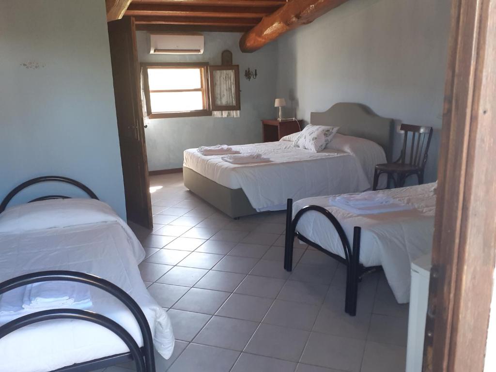 Postel nebo postele na pokoji v ubytování Agriturismo la Gioia