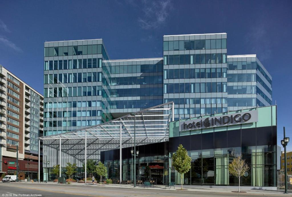 a large glass building in front of a building at Hotel Indigo Denver Downtown - Union Station by IHG in Denver