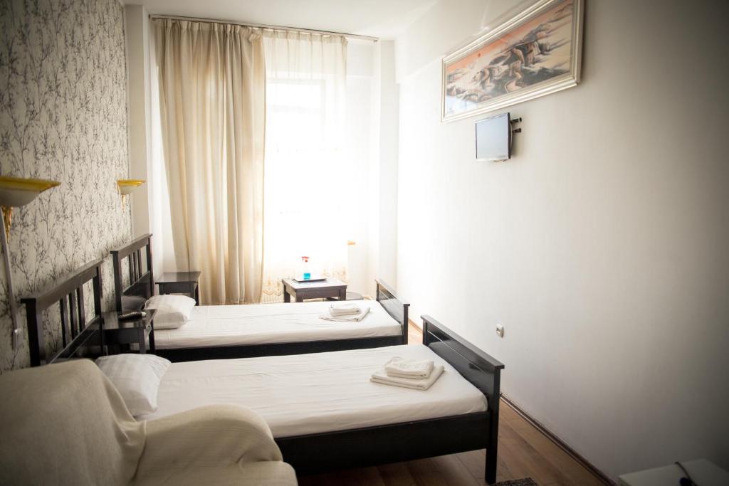 Postel nebo postele na pokoji v ubytování Hotel Funnytime