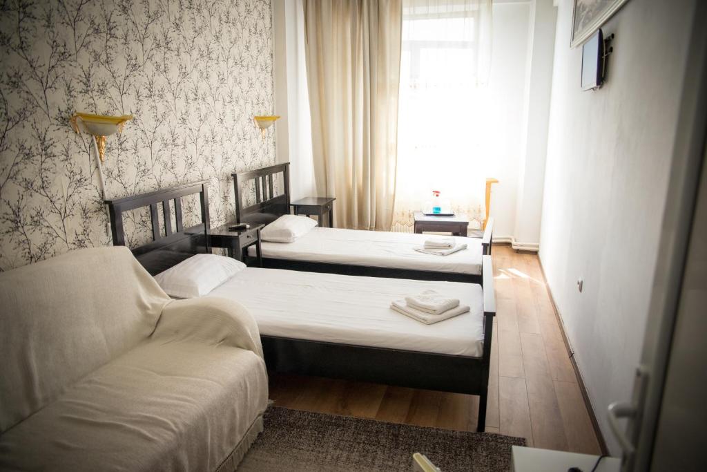 Postel nebo postele na pokoji v ubytování Hotel Funnytime