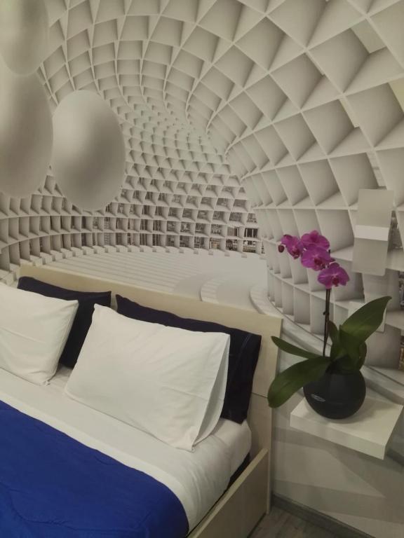 Łóżko lub łóżka w pokoju w obiekcie B&B via Piave da Lillo