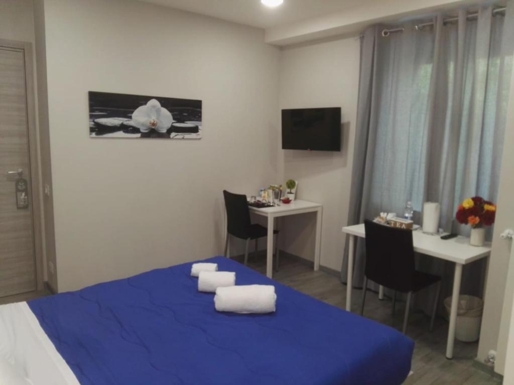 Łóżko lub łóżka w pokoju w obiekcie B&B via Piave da Lillo