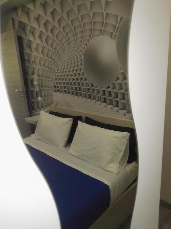 Łóżko lub łóżka w pokoju w obiekcie B&B via Piave da Lillo