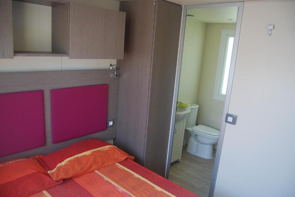 A bed or beds in a room at Casa Mobile - Cisano San Vito ****